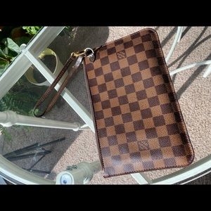 Authentic LOUIS VUITTON DAMIER EBENE WRISTLET W/ RED INTERIOR.